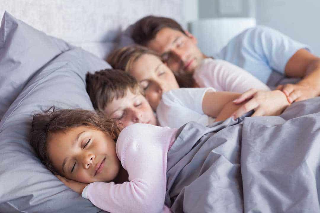 family-bed-with-everyone-sleeping-late